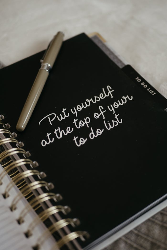 about-01 Close-up of a notebook with an inspirational message to prioritize yourself.